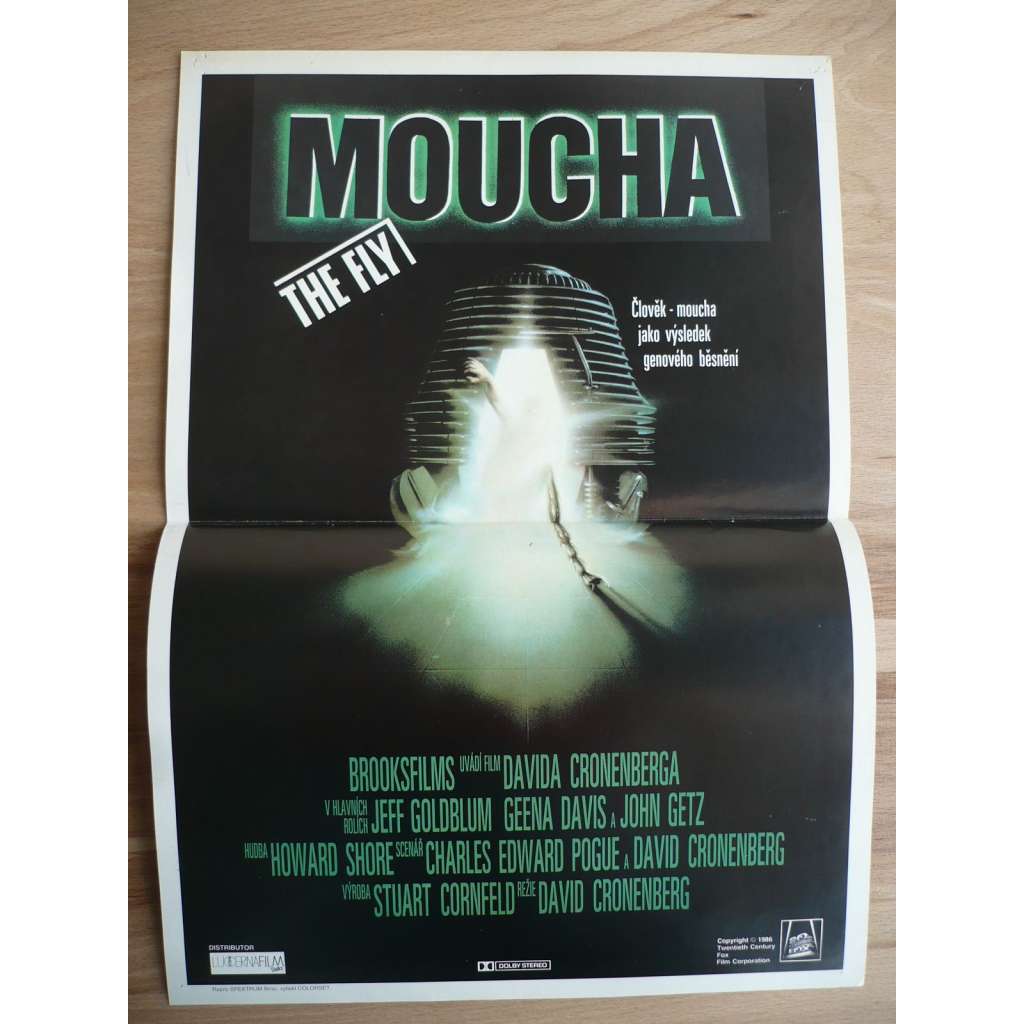 Moucha (filmový plakát, film USA 1986, režie David Cronenberg, Hrají: Jeff Goldblum, Geena Davis, John Getz)